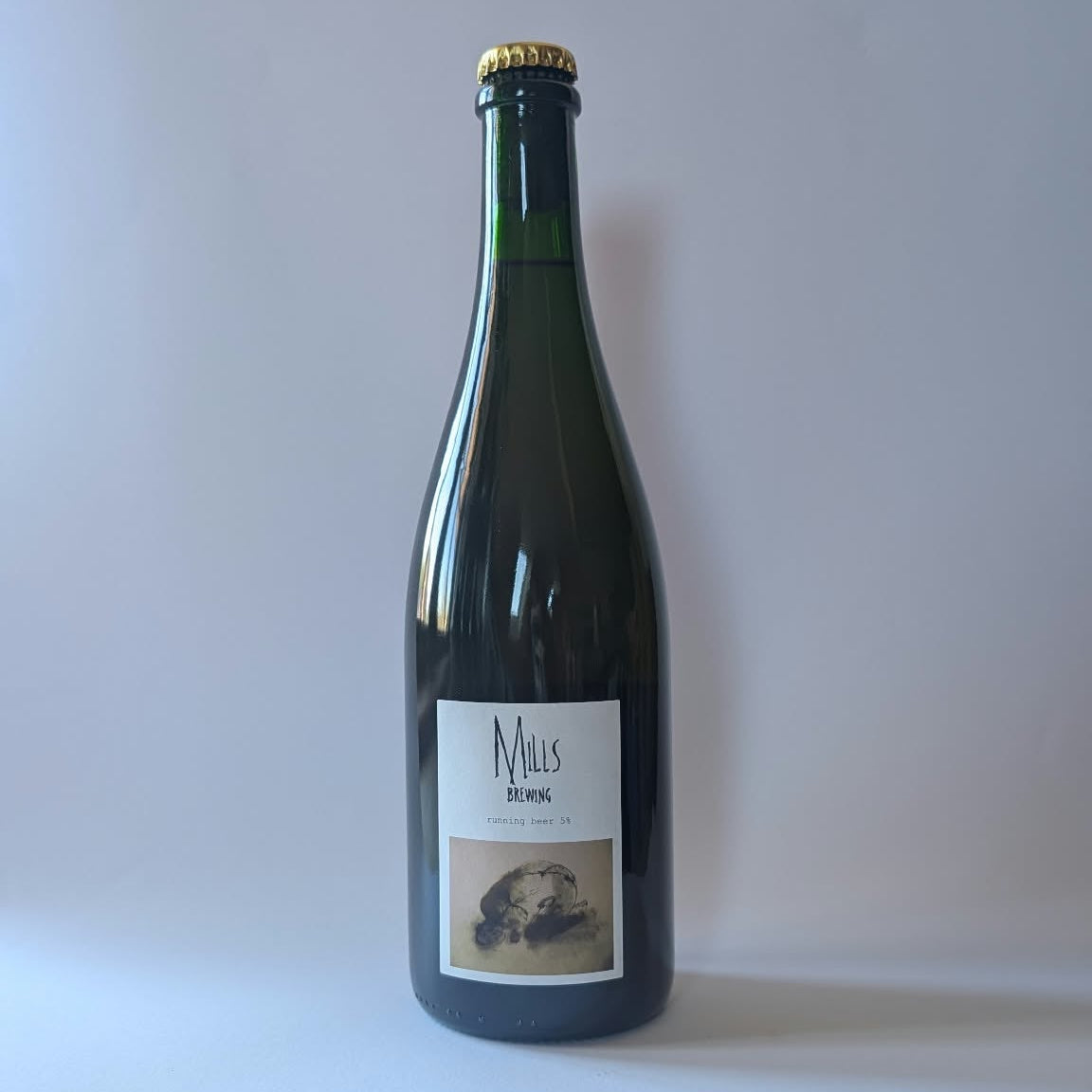 750ml bottle of Mills Brewing - Running Beer. 