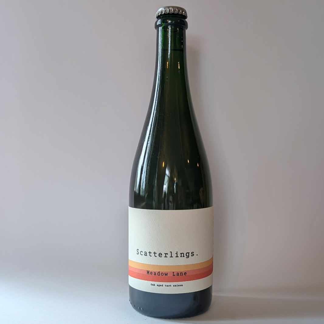 750ml bottle of Scatterlings Brewing & Blending Meadow Lane saison. 
